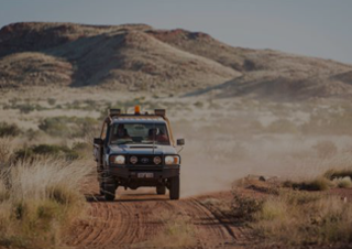 An image of an offroad SUV on an Australian back road