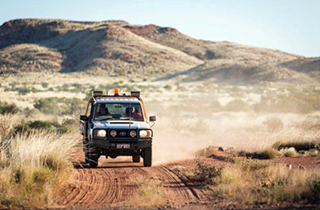 An image of an offroad SUV on an Australian back road