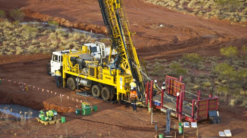 Drill rig in dirt field